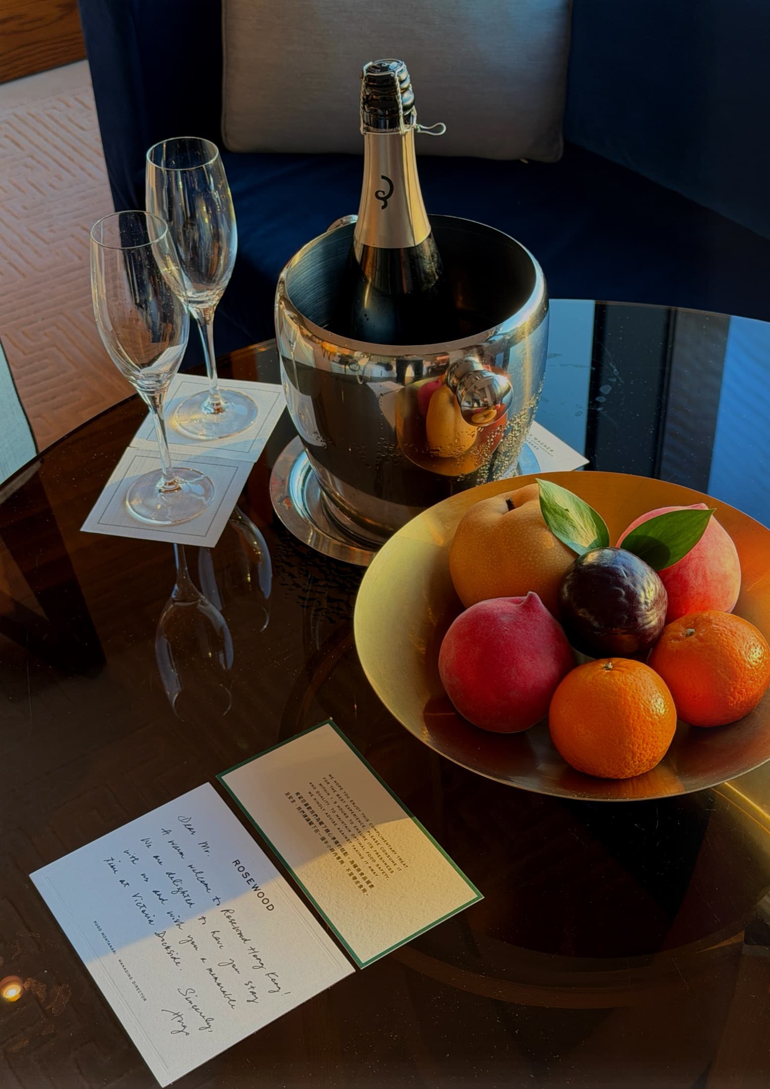 Champagne, fresh fruit and a handwritten Rosewood welcome card