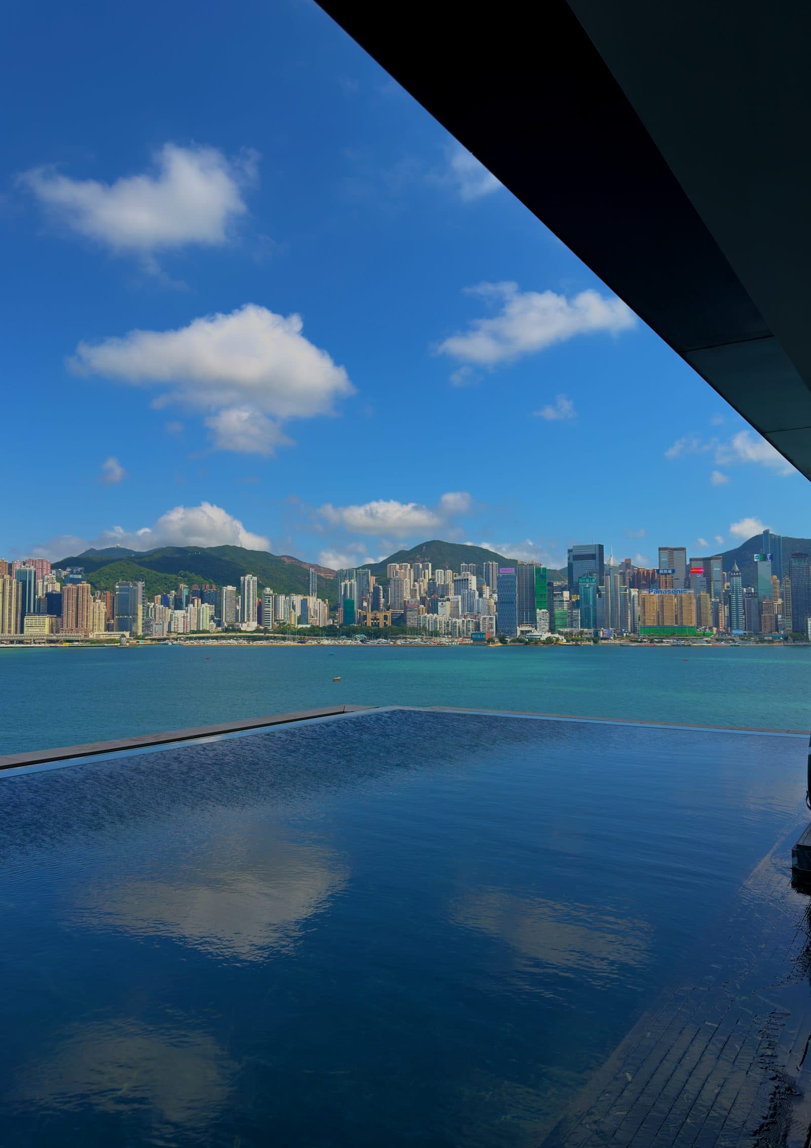 Victoria Harbour and a clear sky seen from the pool deck