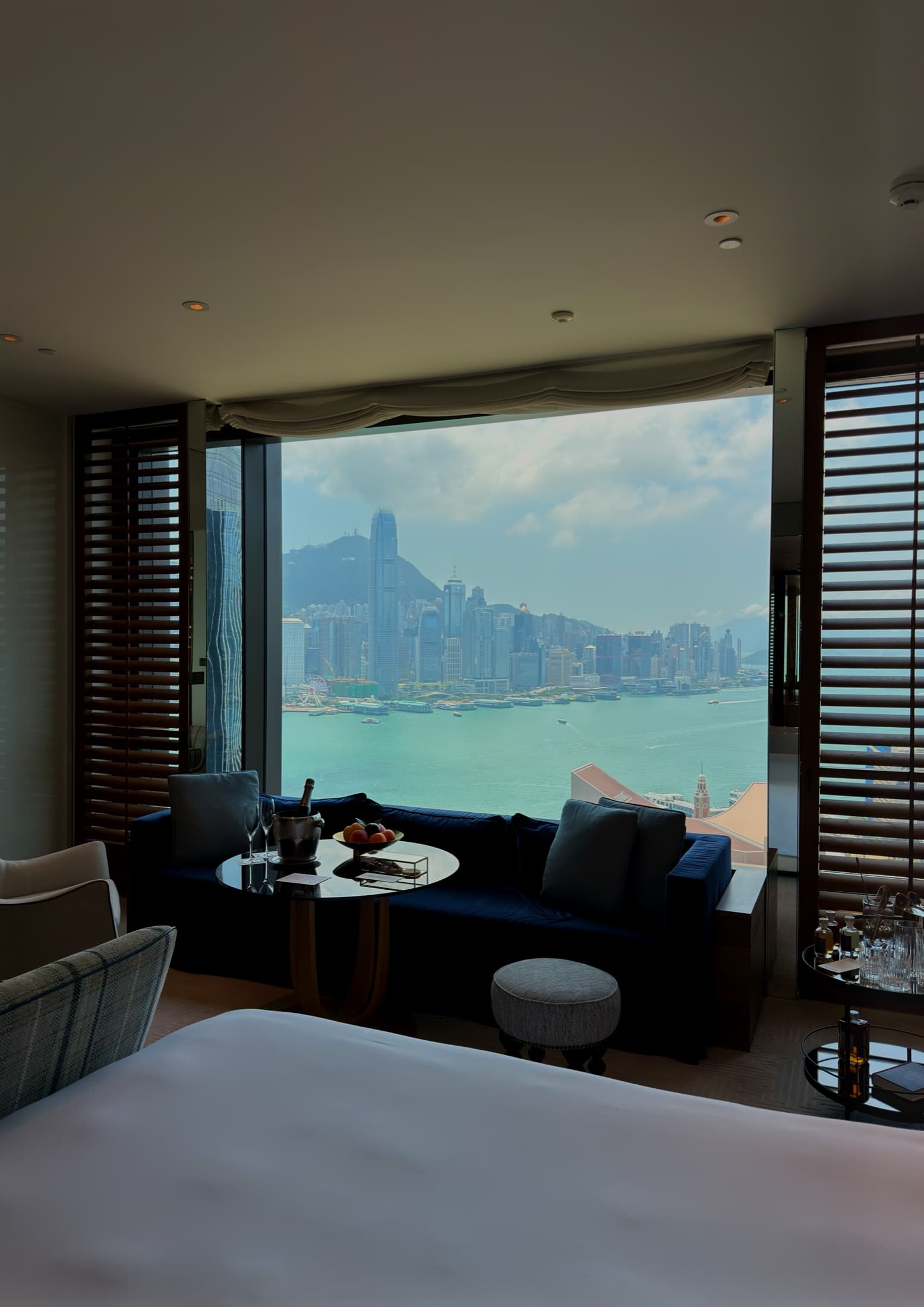 A guest room framing Victoria Harbour and the island skyline