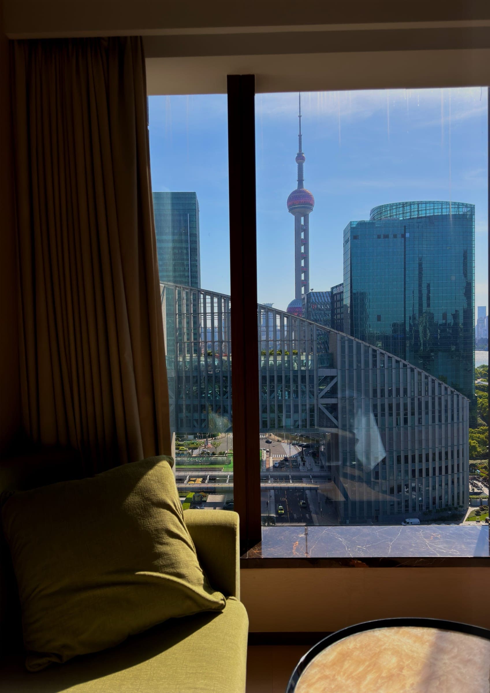 The Oriental Pearl Tower framed in a guest room window